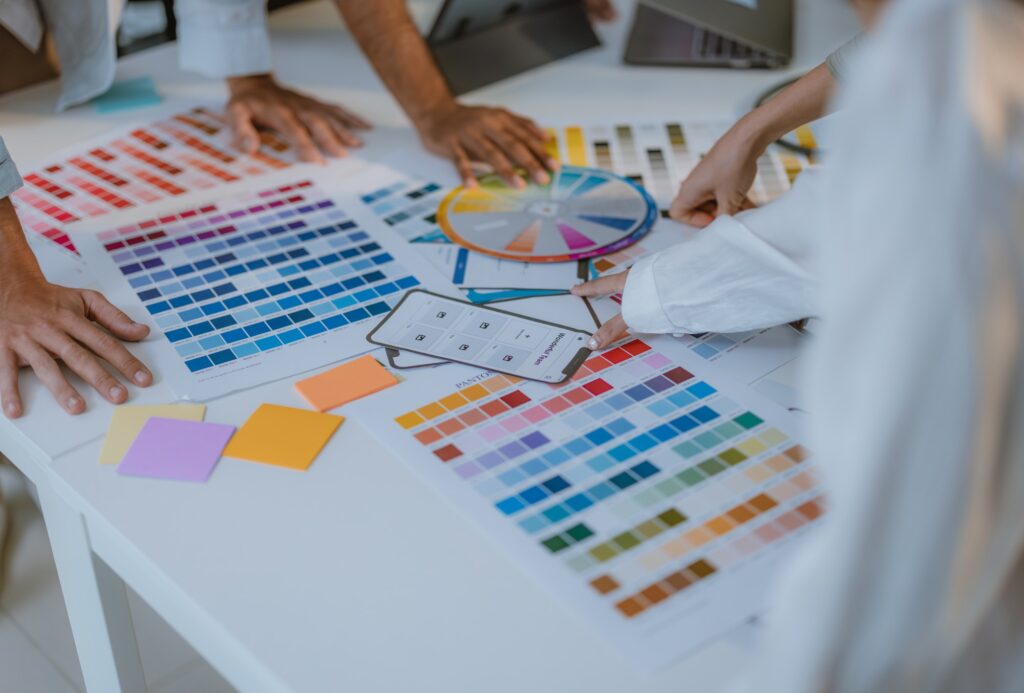 Startup team collaborates on color selection for user centric product design, optimizing experience